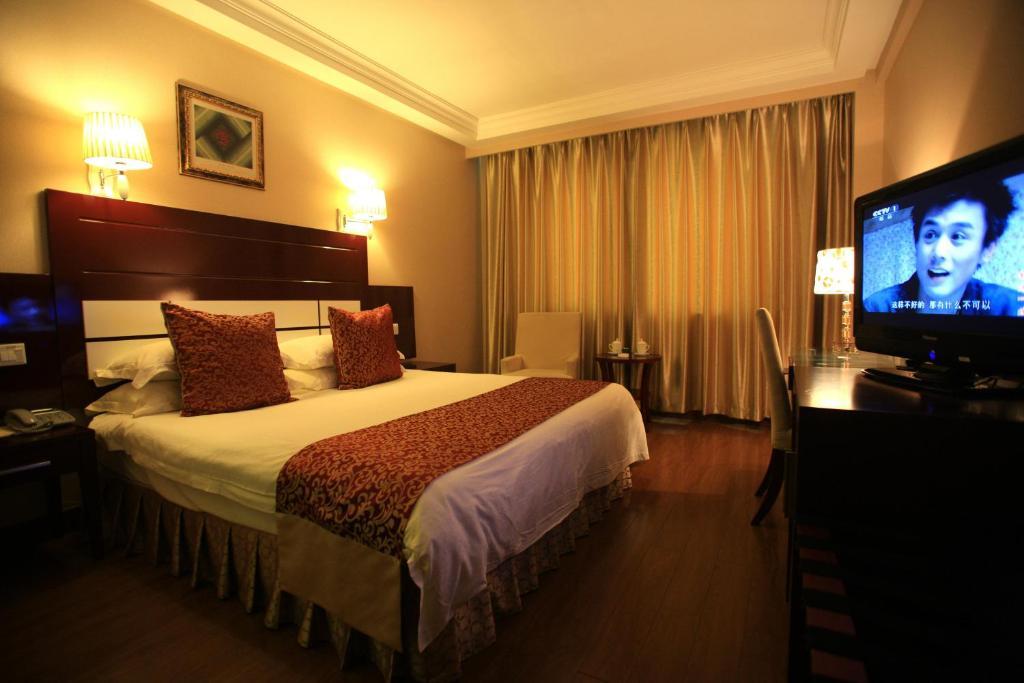 Overseas Chinese International Hotel Циндао Номер фото