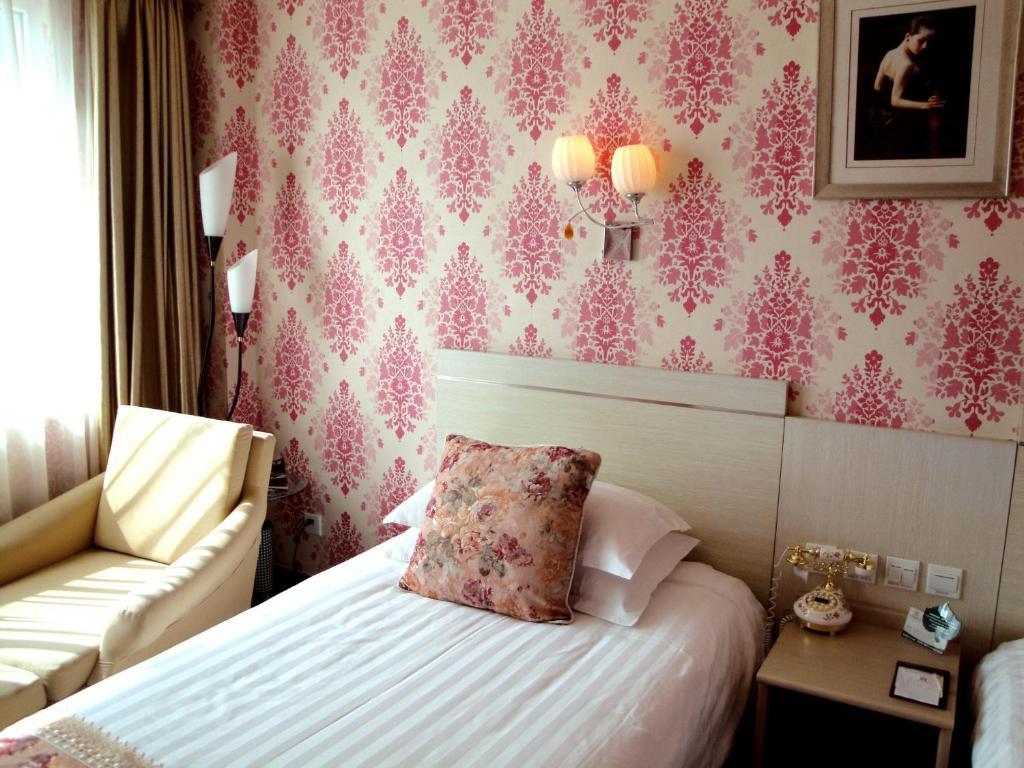 Overseas Chinese International Hotel Циндао Номер фото