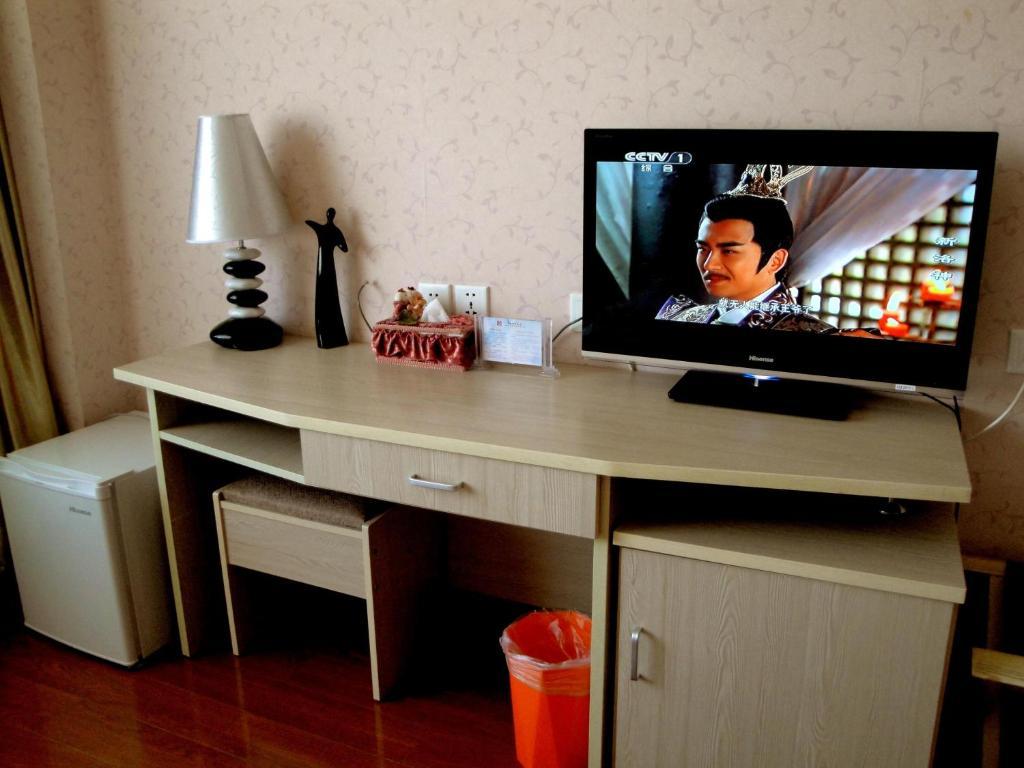 Overseas Chinese International Hotel Циндао Номер фото