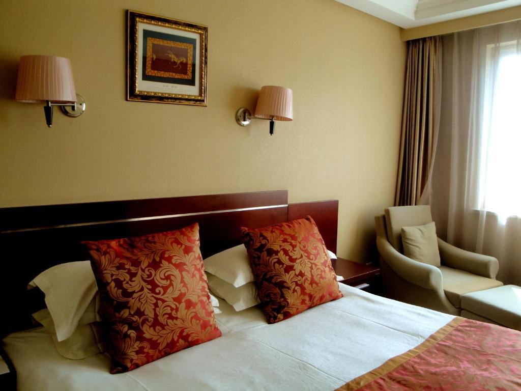 Overseas Chinese International Hotel Циндао Номер фото